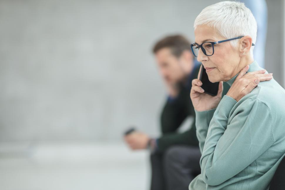 Older person receiving a phone call.